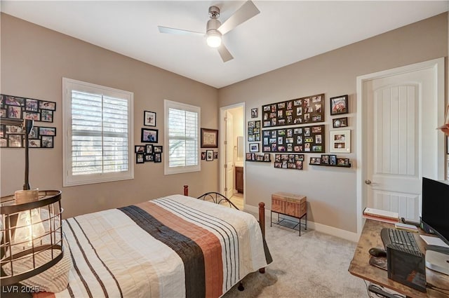 bedroom featuring ceiling fan and light colored carpet