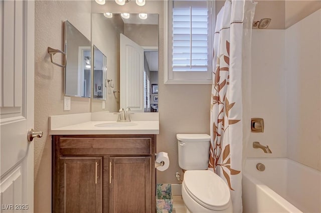 full bathroom with shower / tub combo with curtain, vanity, and toilet