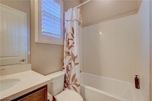 full bathroom featuring vanity, shower / bathtub combination with curtain, and toilet