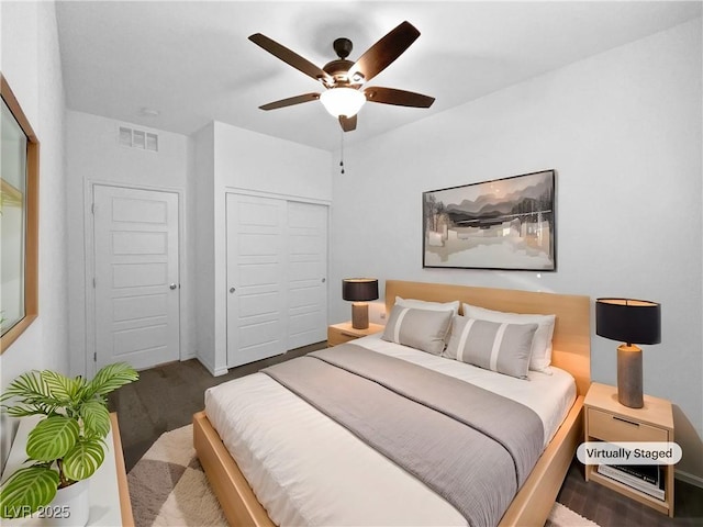 bedroom featuring ceiling fan and a closet