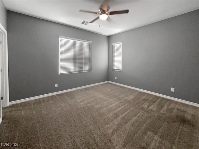 carpeted empty room featuring ceiling fan