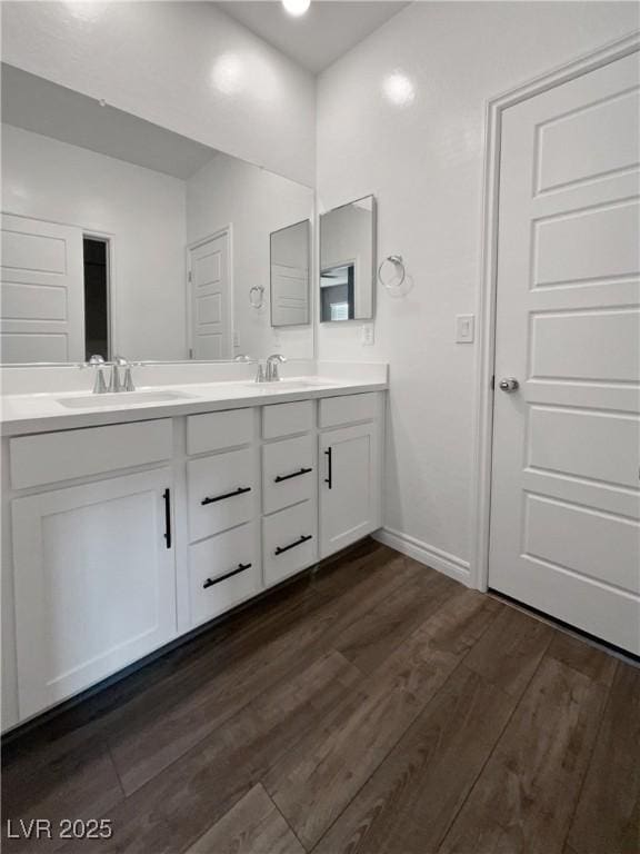 bathroom featuring wood-type flooring and vanity