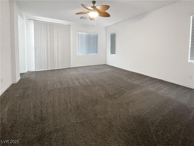 carpeted empty room featuring ceiling fan