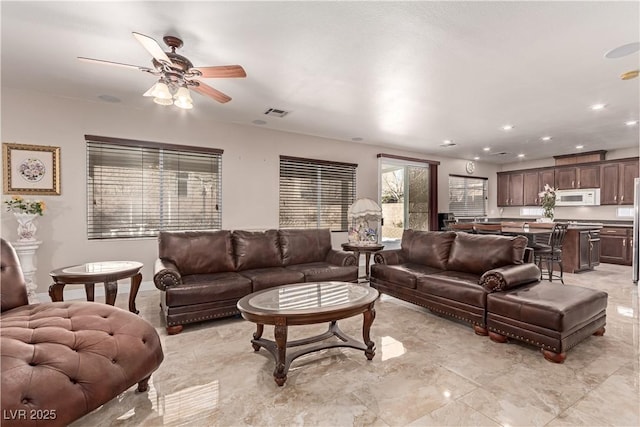 living room with ceiling fan