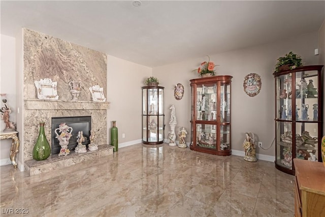 living room featuring a large fireplace