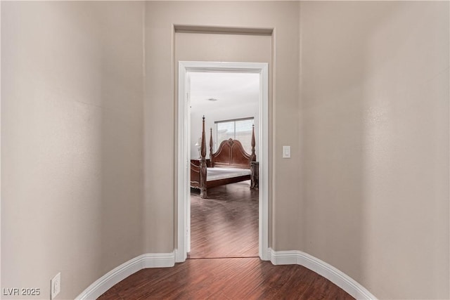 corridor featuring wood-type flooring