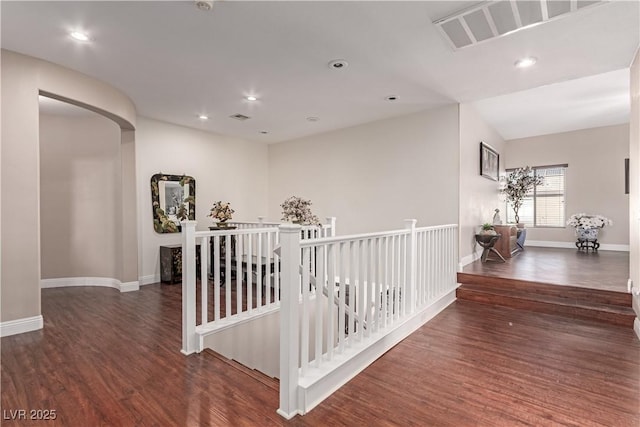 corridor with dark hardwood / wood-style floors