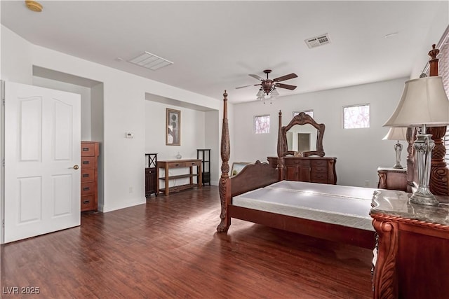 bedroom with ceiling fan and dark wood-type flooring