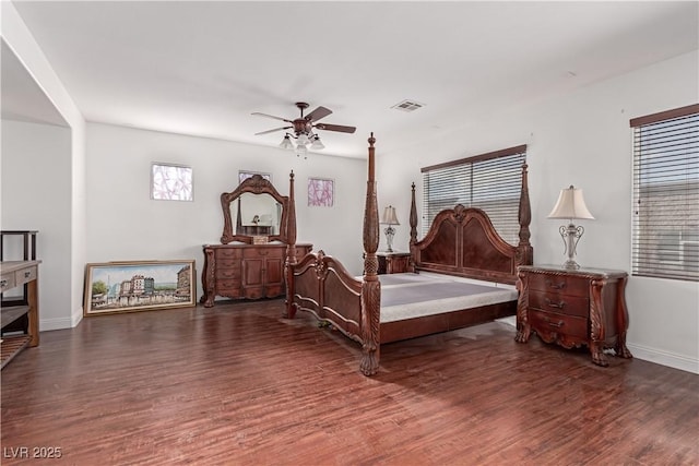 bedroom featuring ceiling fan and dark hardwood / wood-style floors