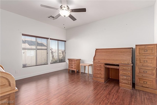 unfurnished office with ceiling fan and dark wood-type flooring