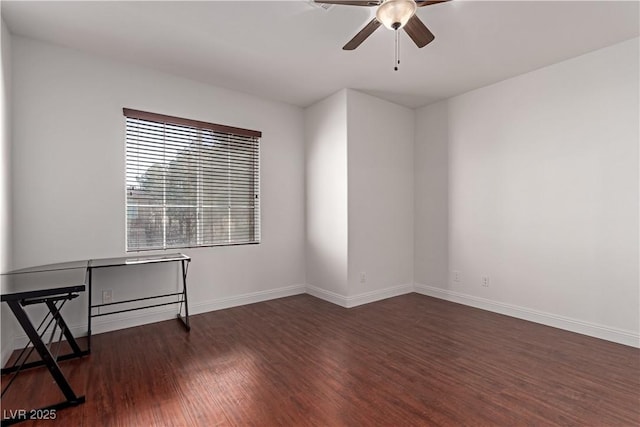 unfurnished room with ceiling fan and dark hardwood / wood-style flooring