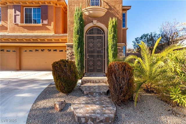 doorway to property with a garage