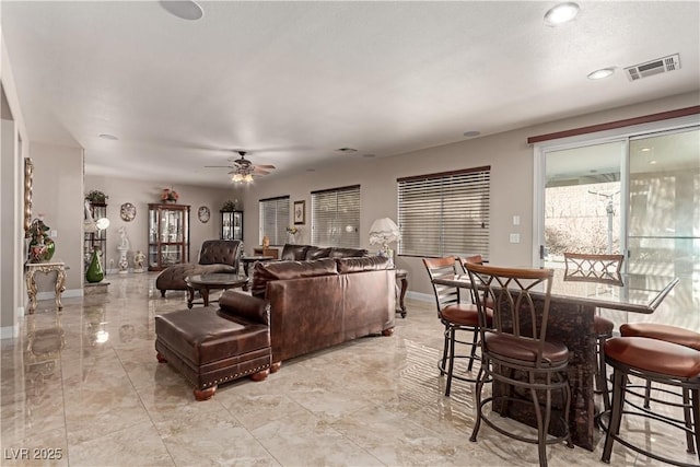 living room featuring ceiling fan