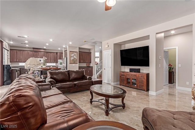 living room featuring ceiling fan