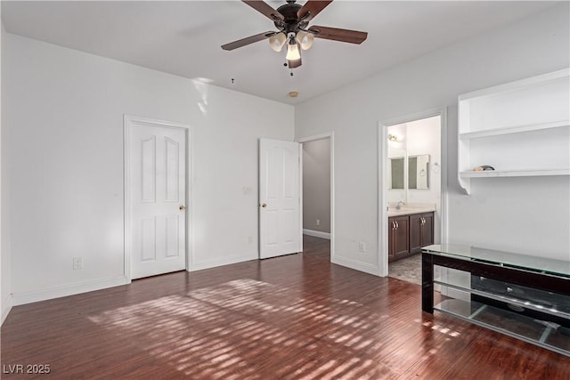 bedroom with ceiling fan, ensuite bath, dark hardwood / wood-style flooring, and sink