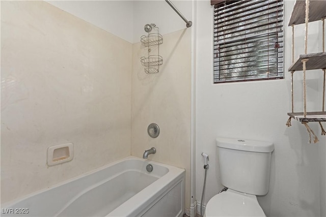 bathroom with toilet and shower / bathing tub combination