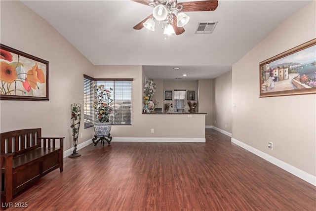 interior space featuring ceiling fan and dark hardwood / wood-style flooring