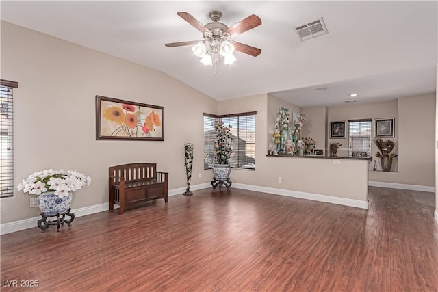 sitting room featuring ceiling fan, vaulted ceiling, and dark hardwood / wood-style flooring