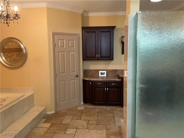 bathroom featuring a notable chandelier and crown molding