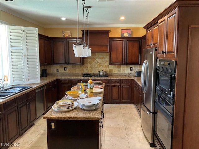 kitchen featuring stainless steel appliances, backsplash, pendant lighting, crown molding, and sink