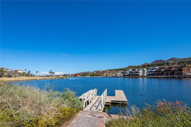 view of dock featuring a water and mountain view