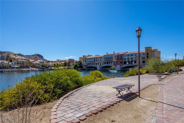 view of community with a water view