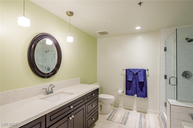 bathroom featuring tile patterned flooring, vanity, an enclosed shower, and toilet