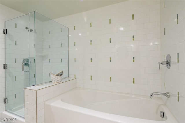 bathroom with shower with separate bathtub