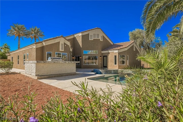 rear view of house with a patio area