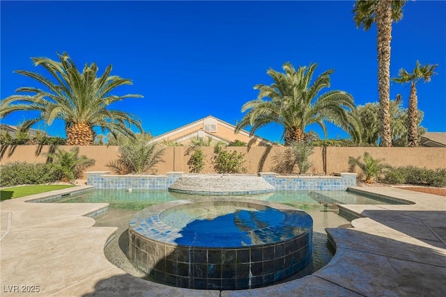 view of swimming pool featuring an in ground hot tub