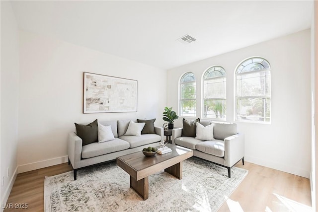 living room with light hardwood / wood-style flooring