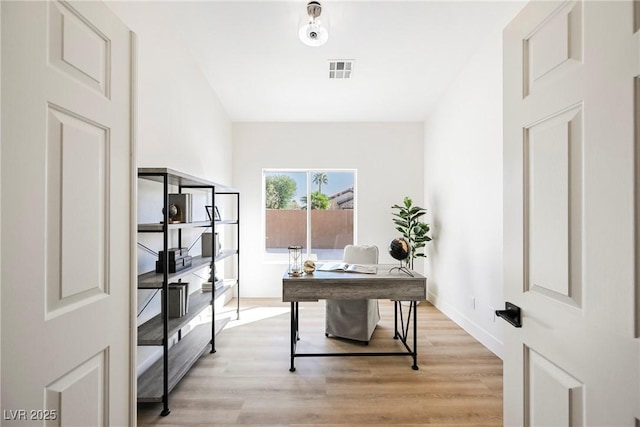 home office with light wood-type flooring