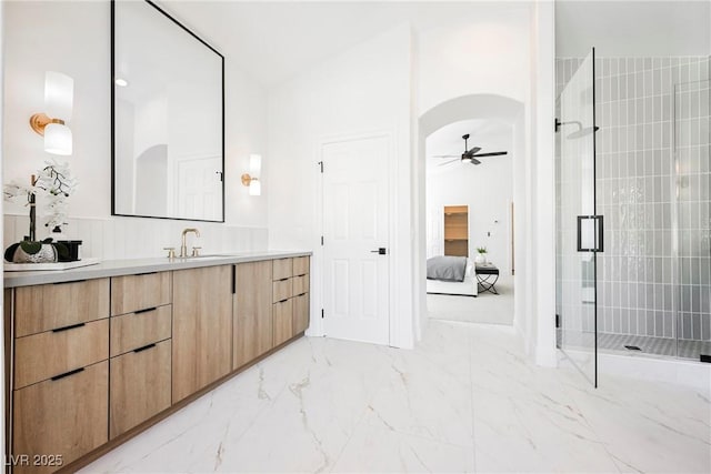 bathroom featuring vanity, vaulted ceiling, an enclosed shower, and ceiling fan