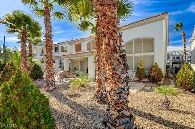 back of property featuring a patio