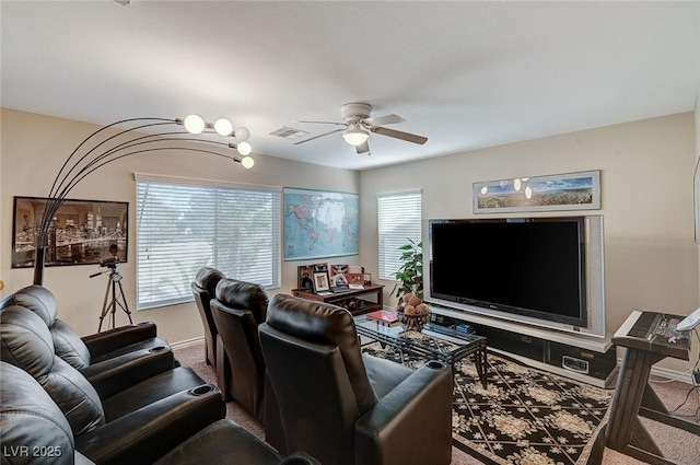 carpeted living room with ceiling fan