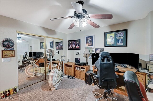 office space with carpet and ceiling fan