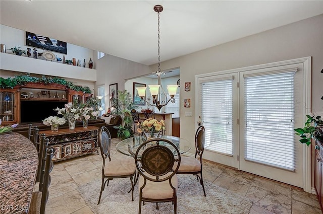 dining area with an inviting chandelier