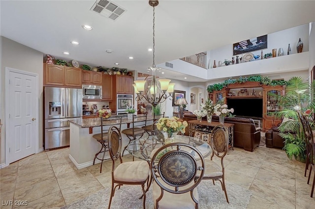 dining space with a chandelier