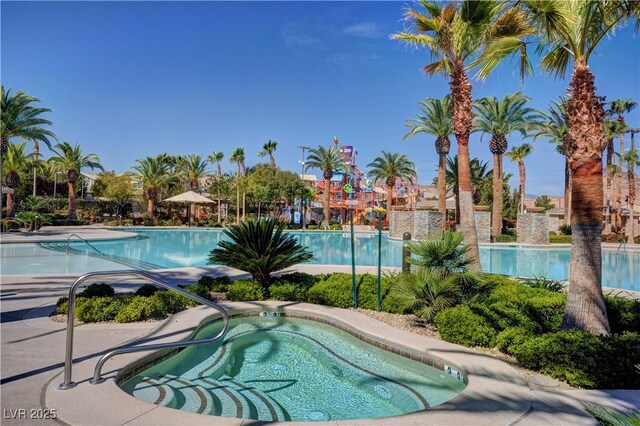 view of swimming pool featuring a community hot tub