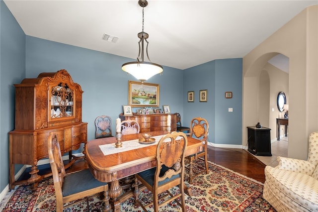 dining room with wood-type flooring