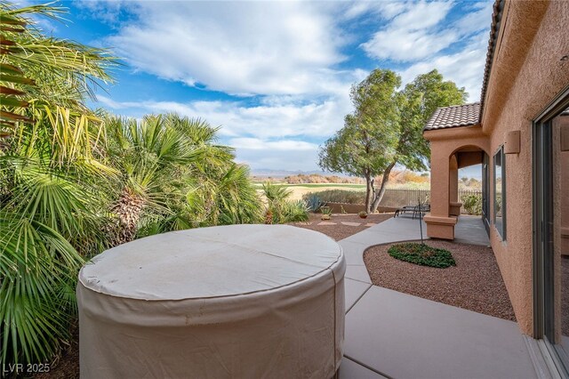 view of patio featuring a hot tub