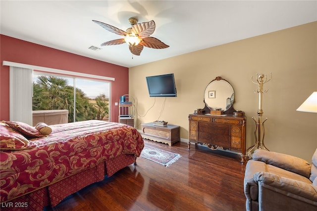 bedroom with ceiling fan and dark wood-type flooring