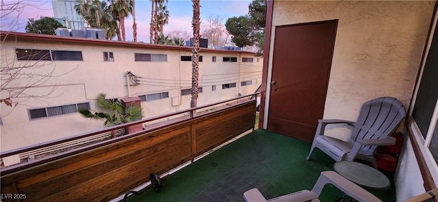 view of balcony at dusk