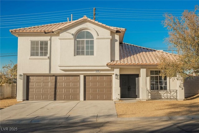 mediterranean / spanish-style house featuring a garage