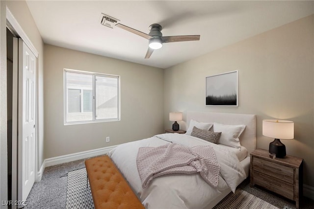 carpeted bedroom with ceiling fan and a closet