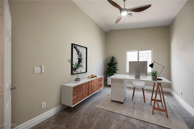 carpeted home office featuring ceiling fan