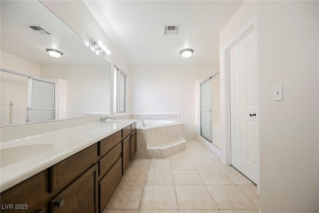 bathroom featuring vanity, tile patterned floors, and separate shower and tub