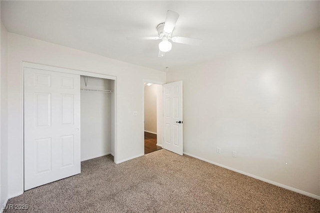 unfurnished bedroom featuring carpet flooring, a closet, and ceiling fan