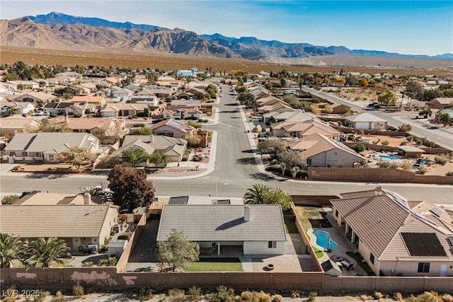 birds eye view of property featuring a mountain view