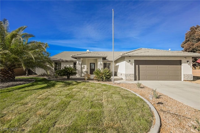 view of front of house featuring a front yard and a garage